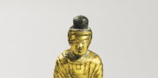 A GILT-BRONZE FIGURE OF SEATED BUDDHA