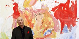 Georg Baselitz with one of his self-portraits at the Gagosian Gallery in London.